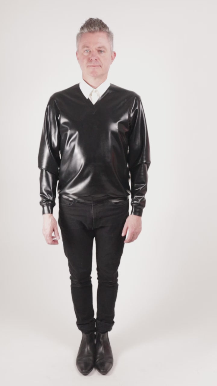 Video of Fabian in his black latex v-neck doing funny moves with his pointy shoes.