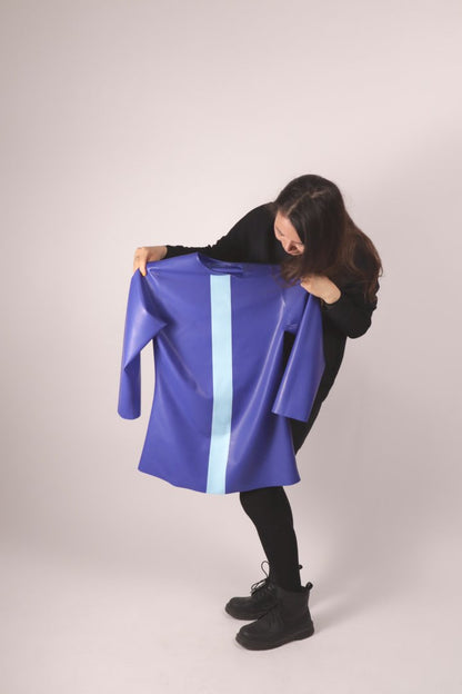 our model holding up our royal blue latex 60s mini dress