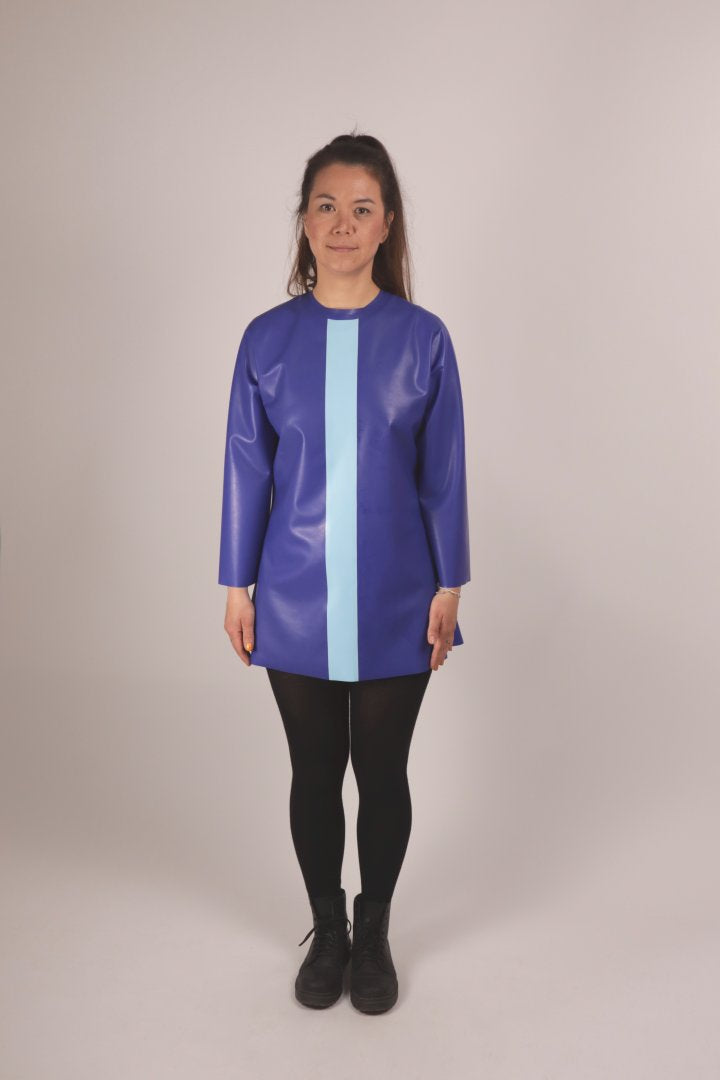 front view of our model in a blue latex 60s mini dress with a vertical baby blue stripe on the front