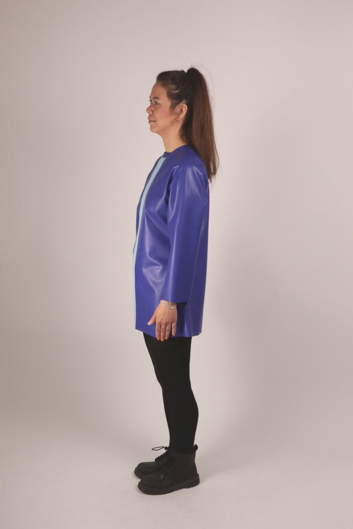 side view of our model in a royal blue latex 60s longsleeve mini dress