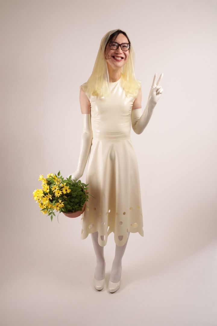 Hani smiling in our TARZA & JANE lacey wedding dress.