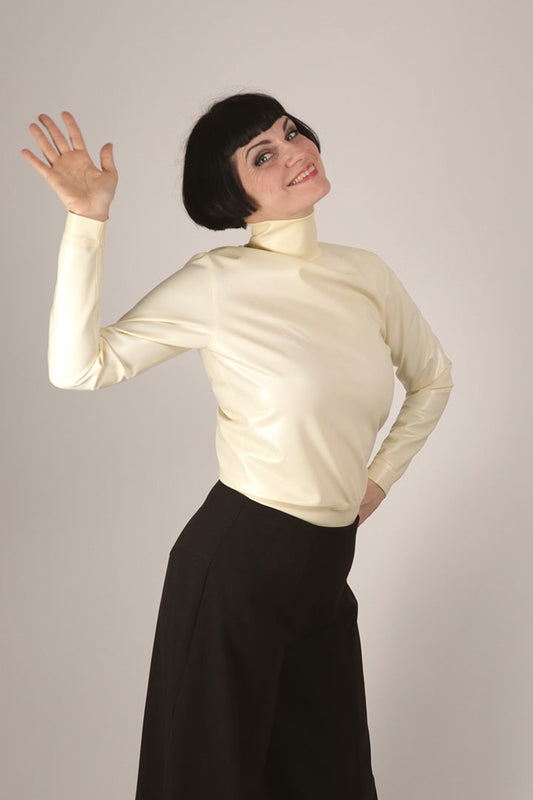 Anja modelling her latex turtleneck top in the color warm white..