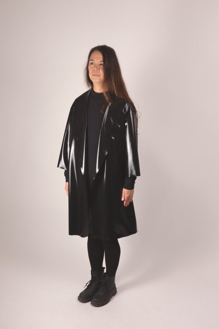 30° front view of christina in the black tarza & jane latex coat.