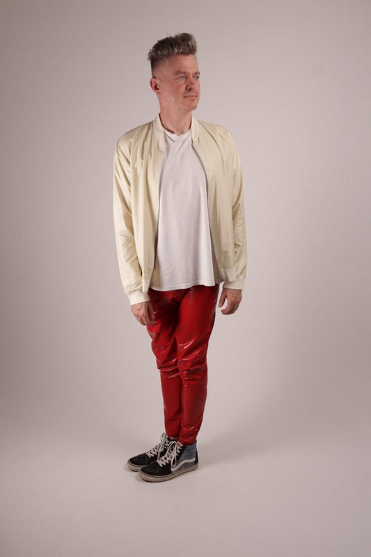 model Fabian in loose red latex rubber leggings combined with Vans and white tee