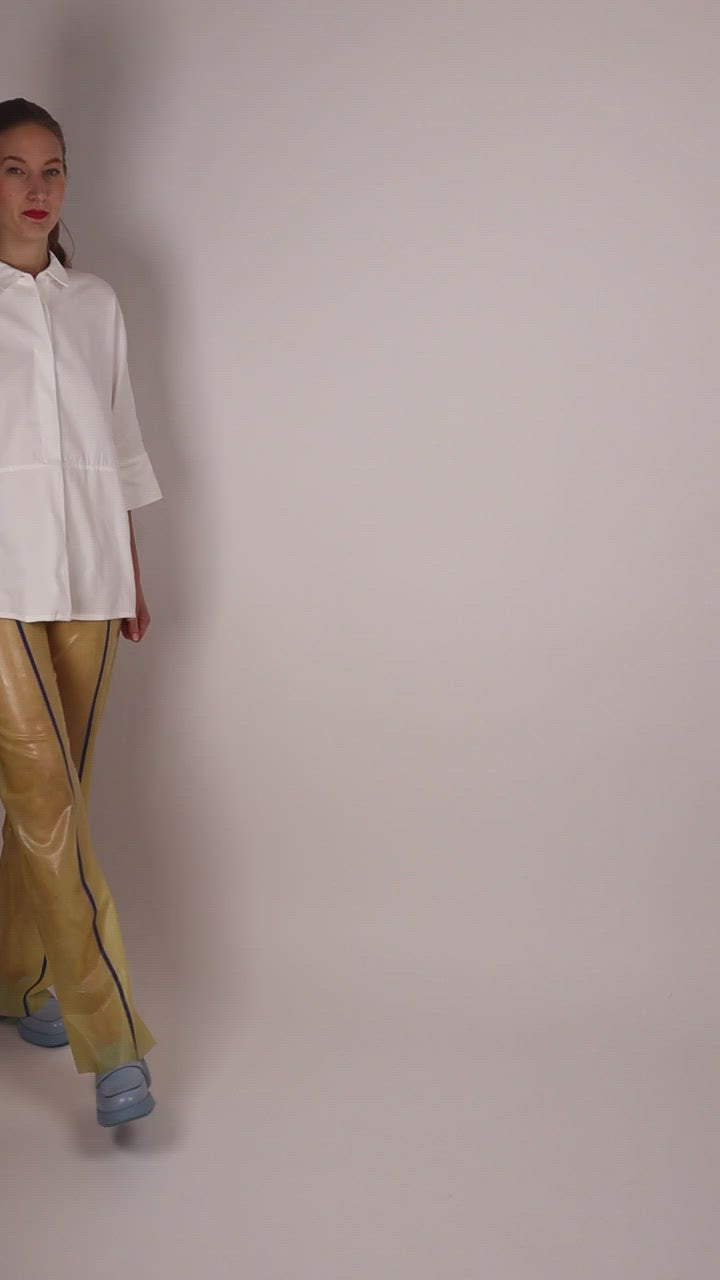 video-of-model-in-transparent-latex-sailor-pants-and-white-dress-shirt