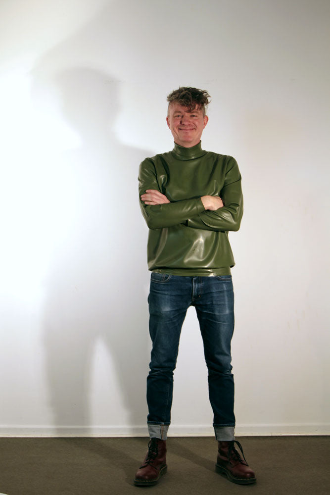 green-latex-turtleneck-sweater-combined-with-blue-jeans
