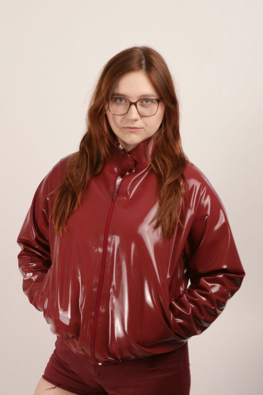 close-up of dark red latex harrington jacket
