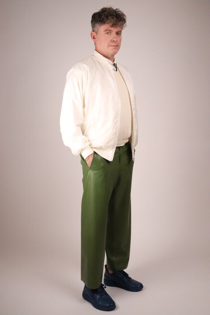 olive-green-latex-flat-front-pants-combined-with-white-tennis-jacket