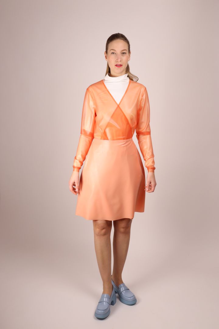 pale-coral-latex-wrap-dress-over-a-white-cotton-turtleneck