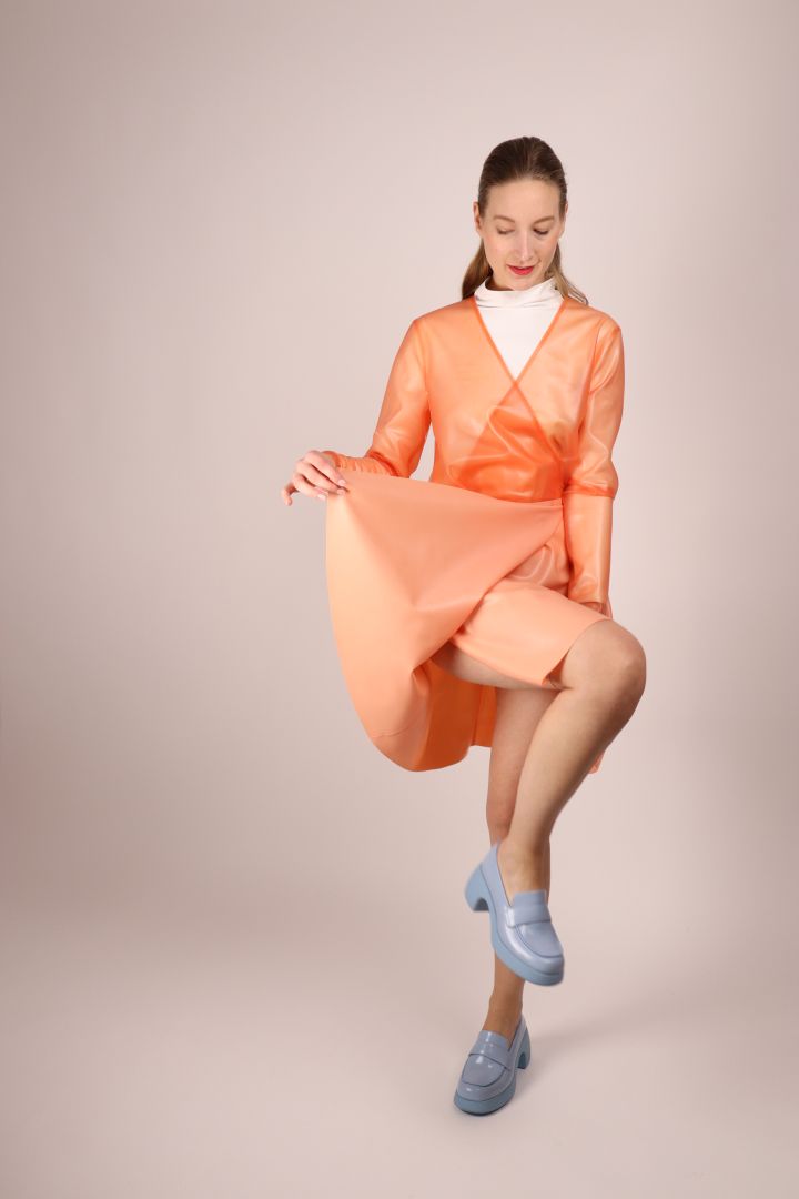 model-dancing-in-latex-wrap-dress
