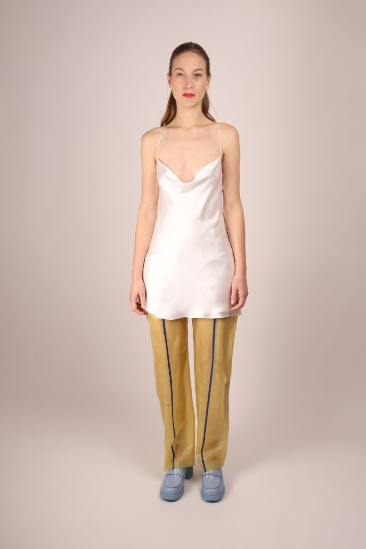 model-in-transparent-latex-sailor-pants-and-white-dress