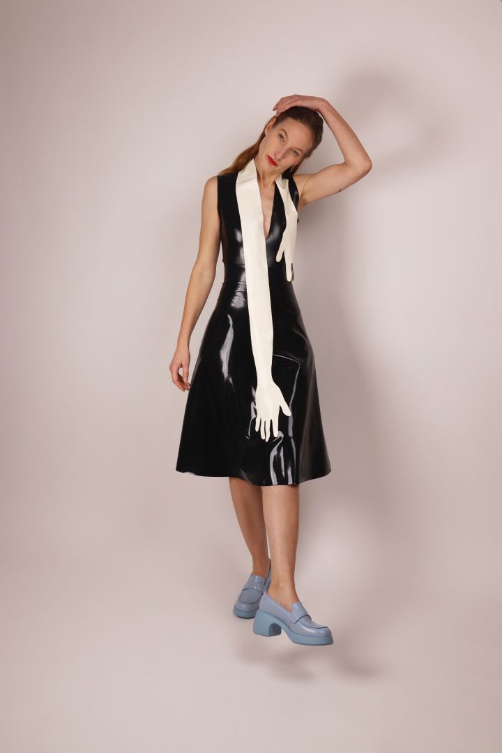 model-in-black-latex-dress-and-white-latex-hands-scarf