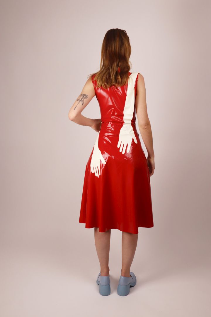 hands-of-white-latex-hands-scarf-on-rear-of-model