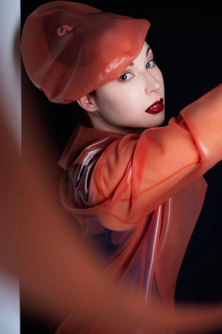 katrin-schönfisch-wearing-transparent-salmon-latex-beret-and-matching-latex-coat