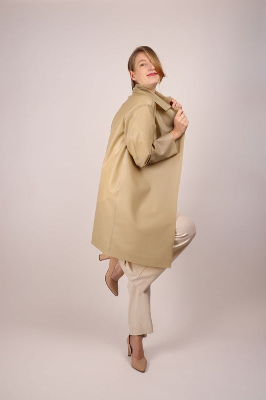 mona-striking-a-pose-in-pale-sand-latex-coat