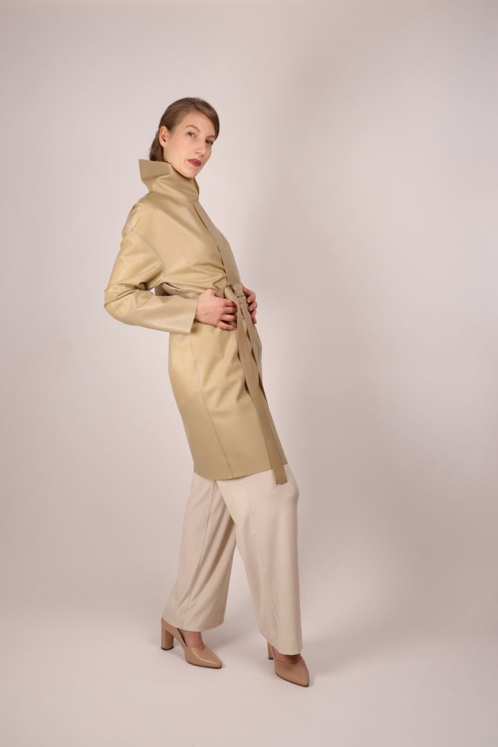 mona-posing-in-sand-latex-trenchcoat-with-belt-and-folded-up-collar