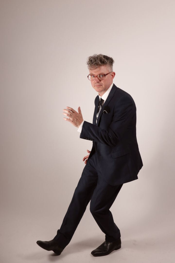 Fabian doing the twist in his navy blue business suit, white dress shirt and his black narrow latex neck tie with matching latex pocket square.