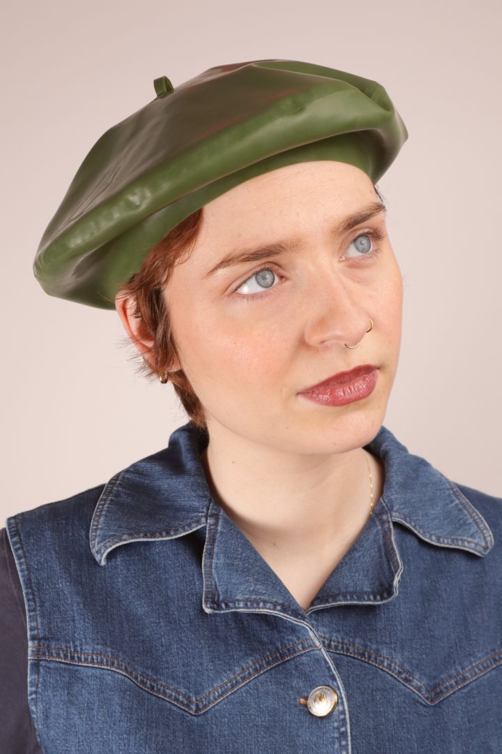 Annabel sporting an olive green latex beret 