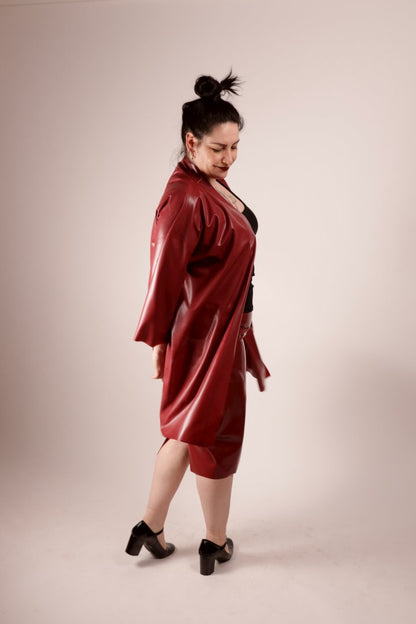 our model sadic sadie in our bordeaux latex fashion kimono and matching pencil skirt, shot from the side in the middle of a little spin to let the kimono fly.