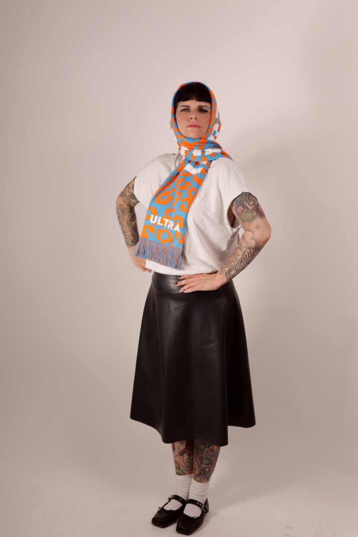 Model Anja wearing her TARZA & JANE fan scarf around her head and shoulders like a babushka.