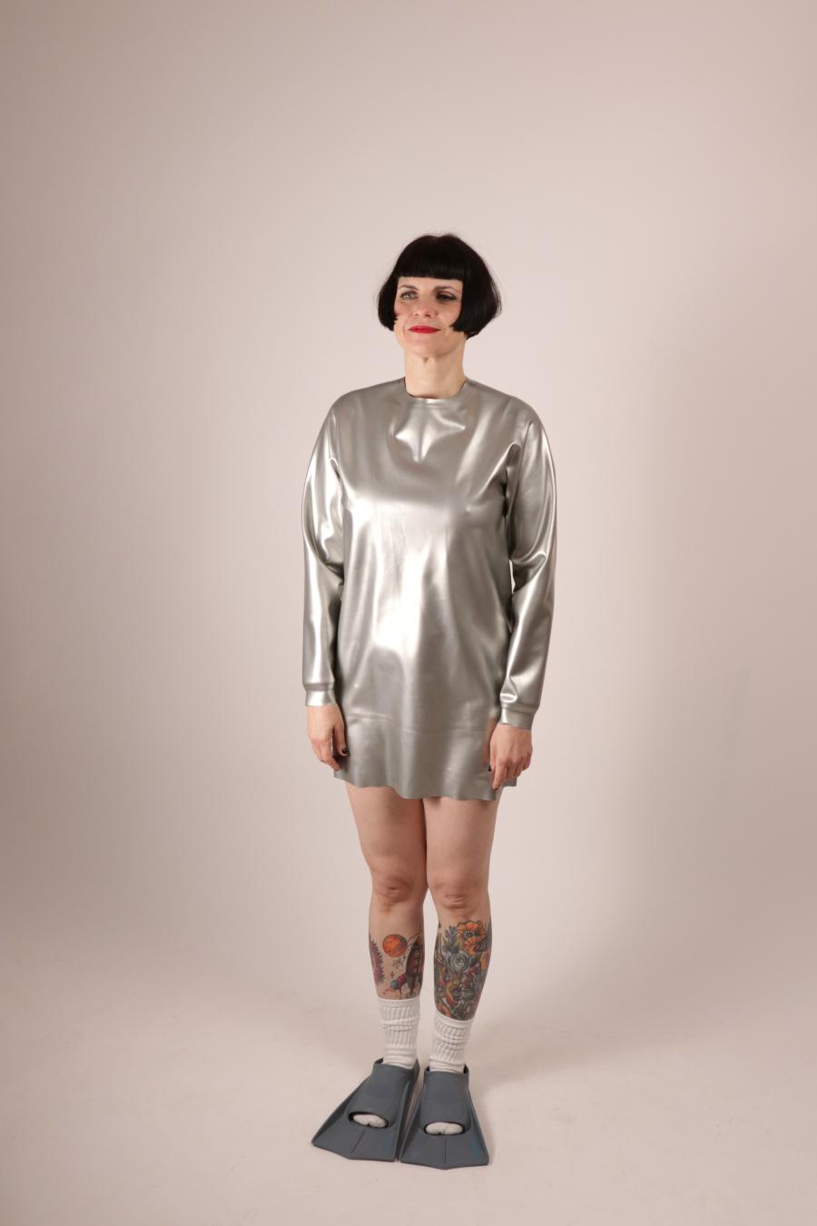 front view of Anja Abels in a silver latex sweatshirt dress