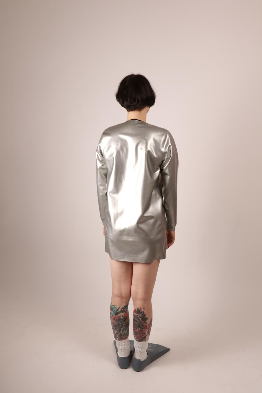 back view of Anja Abels in a silver latex sweatshirt dress