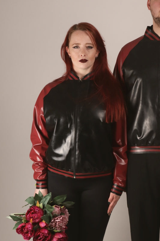 Close-up of Sarah in our black and wine-red latex college jacket. Or varsity jacket, as one would probably call it in the States.