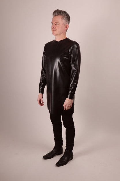 half side view of Fabian and the latex long sweater.