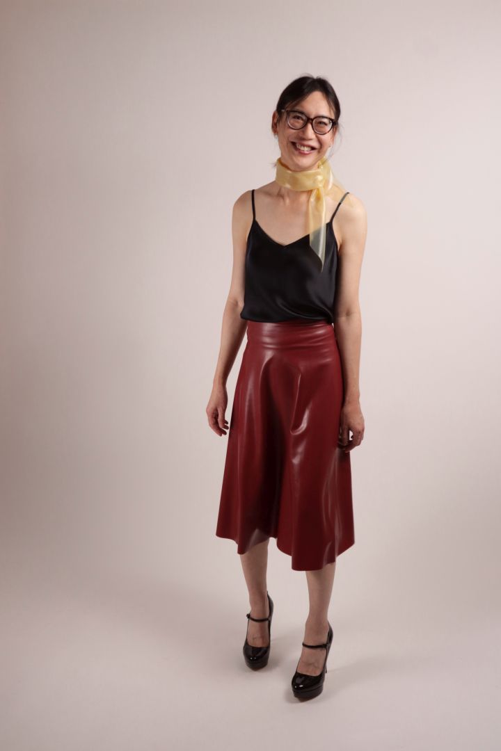Total of Hani wearing the transparent latex scarf, combined with our bordeaux red midi skirt and chic Mary-Janes.