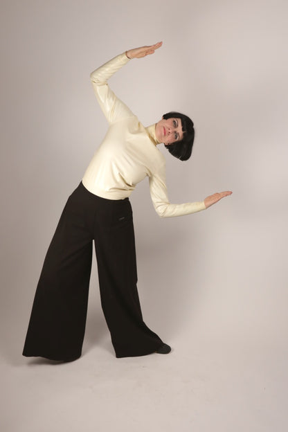 anja doing an art-deco pose in our white latex polo neck