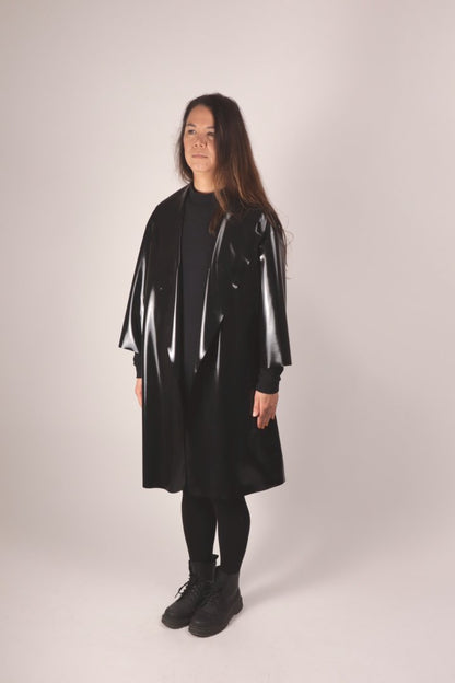 30° front view of christina in the black tarza & jane latex coat. 