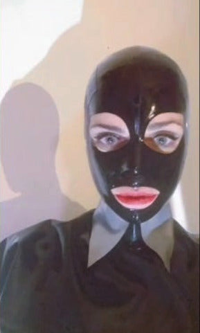 Our model Anja is wearing a black latex mask with a matching loose top, long gloves, and a silver latex high shirt collar a bit like the ones Karl Lagerfeld used to wear. Not so tall, not so stiff, but similar.