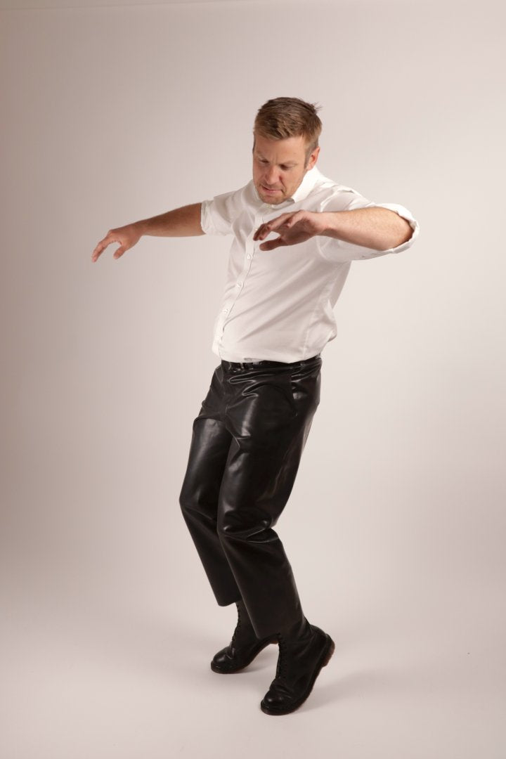 model-doing-elvis-moves-in-black-latex-pants