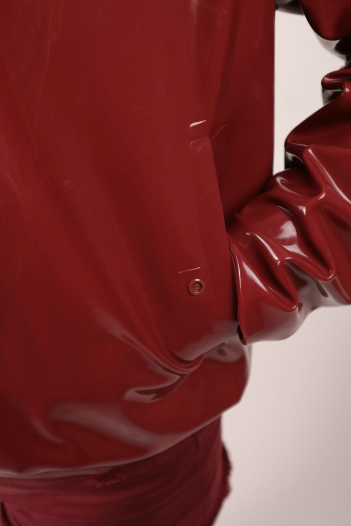 pocket detail of bordeaux red harrington latex jacket