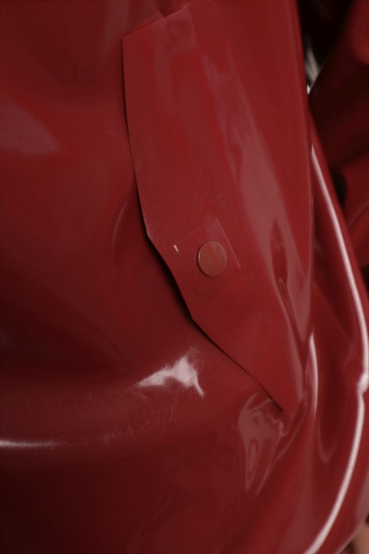 pocket flap detail of mens bordeaux red harrington latex jacket