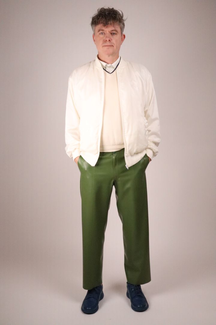olive-green-latex-flat-front-pants-and-white-bomber-jacket