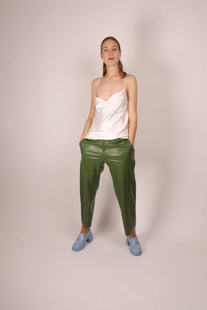 model-striking-a-pose-in-green-womens-latex-flat-front-pants