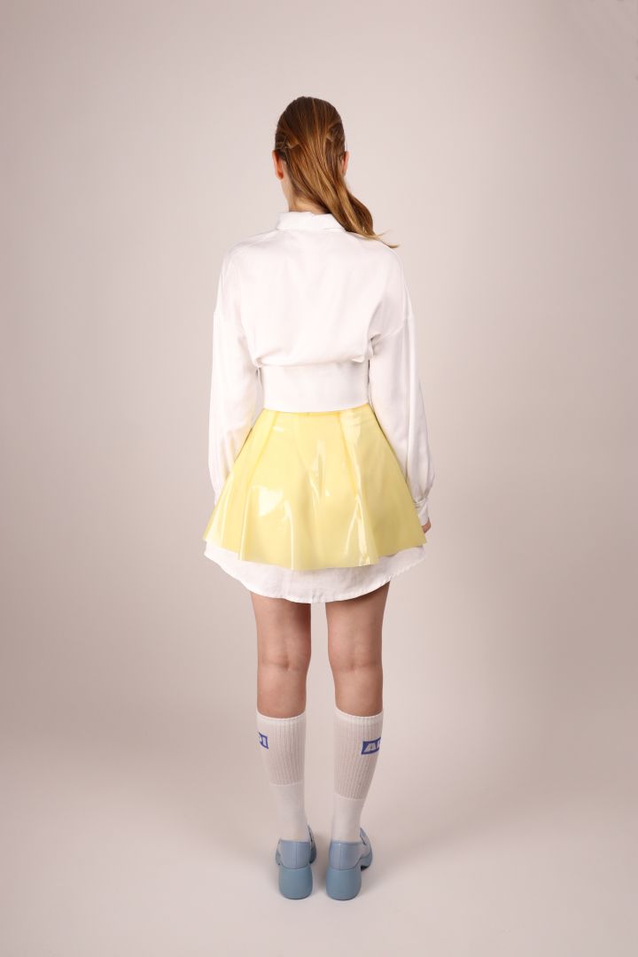 back-view-of-transparent-latex-mini-skirt-over-an-extra-long-dress-shirt