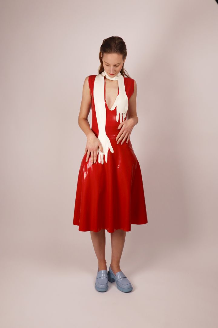 model-with-white-latex-hands-scarf-on-red-latex-dress