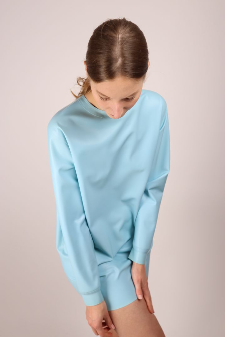 model-striking-a-pose-in-matte-baby-blue-latex-sweatshirt-dress