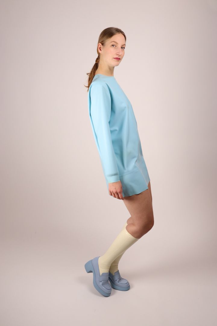 model-striking-a-pose-in-baby-blue-latex-sweatshirt-dress