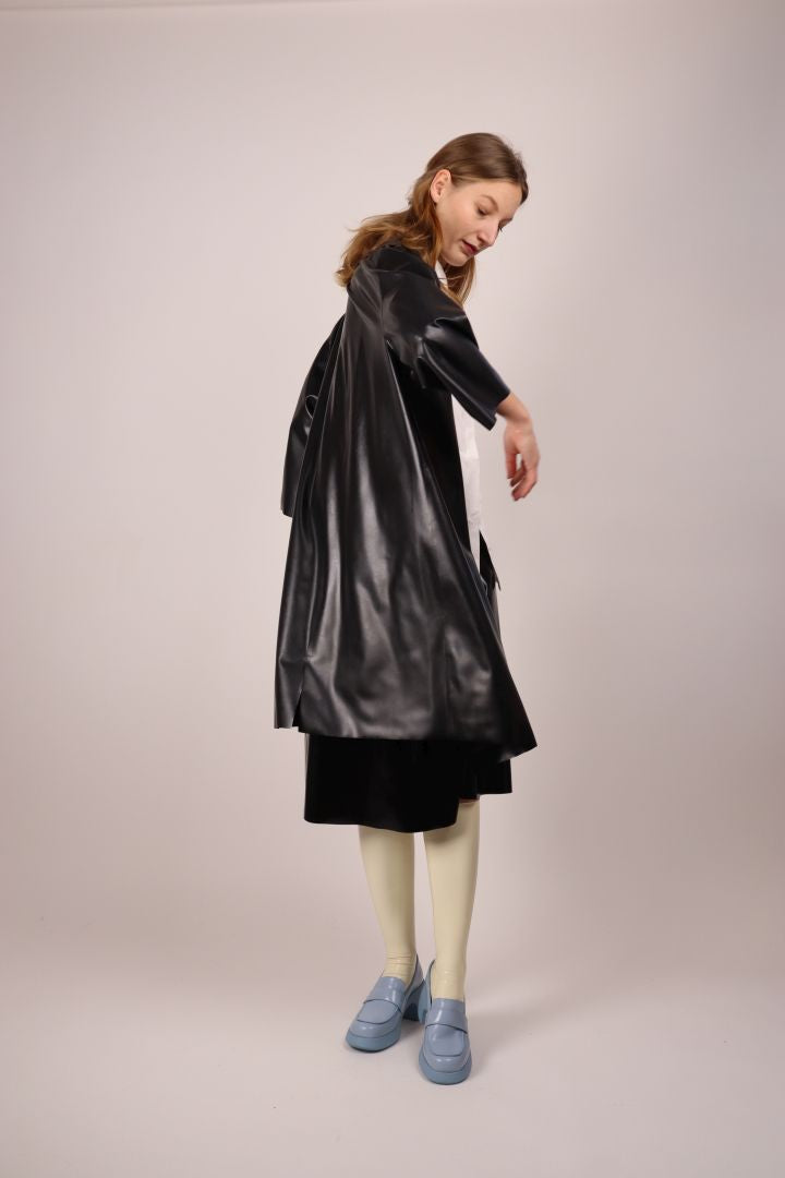 black-latex-trench-coat-over-midi-aline-skirt